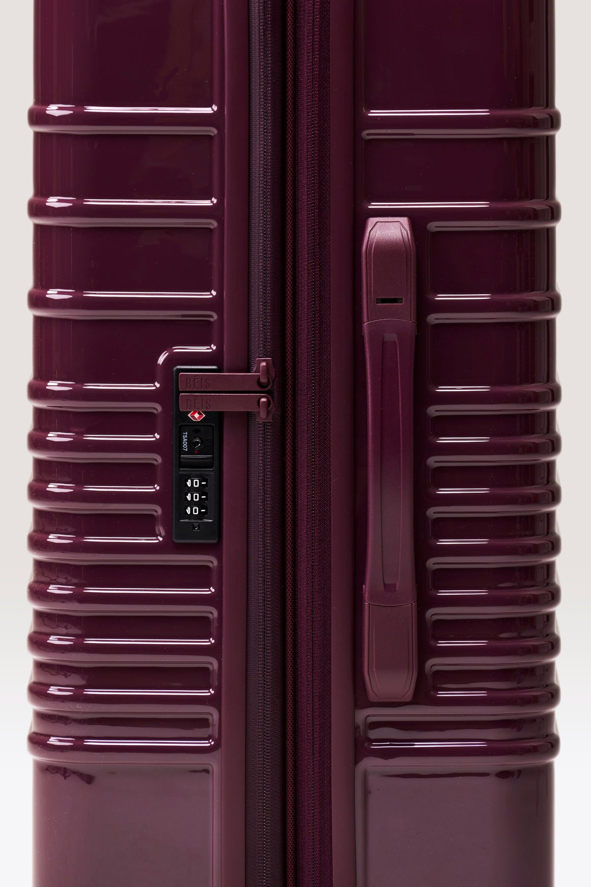 The Medium Check-In Roller in Glossy Plum