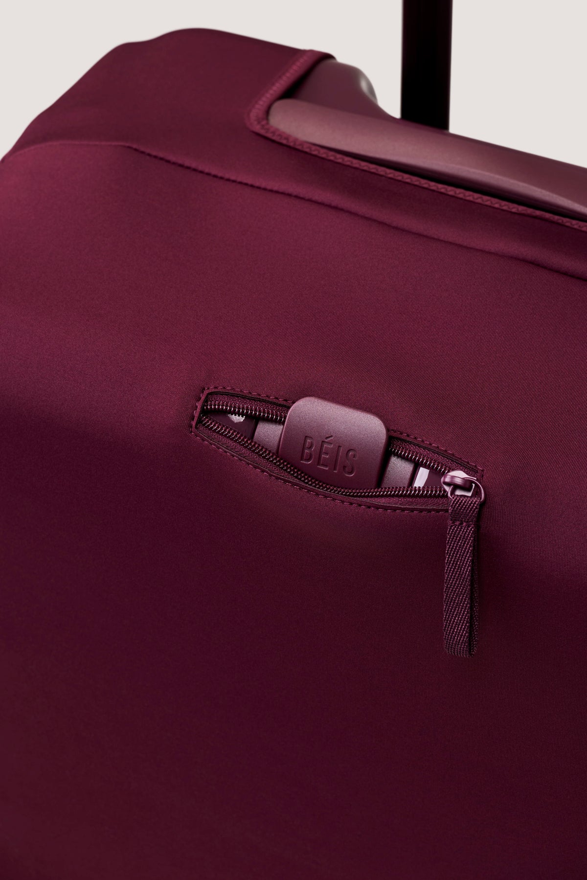 The Medium Check-In Luggage Cover in Plum