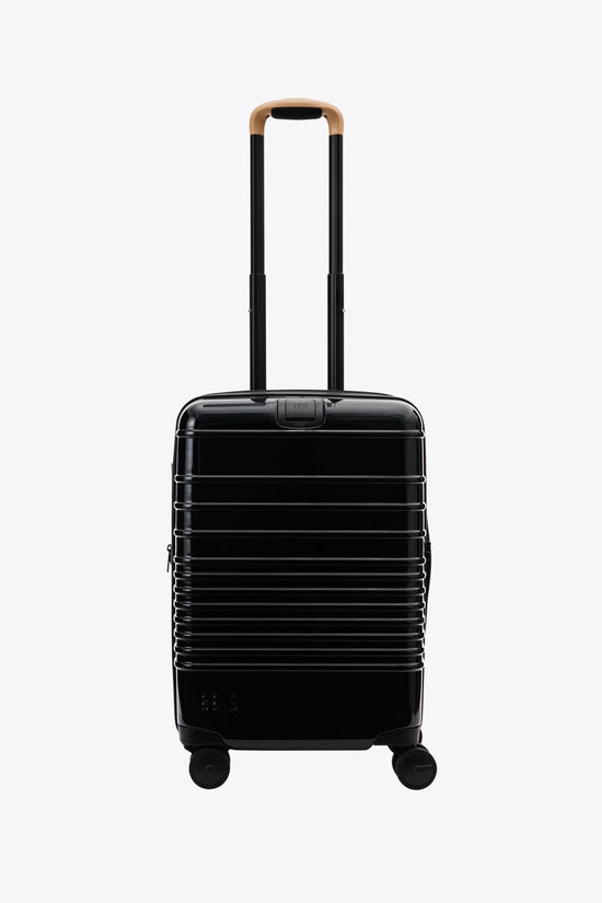 Le Carry-On Roller en noir brillant