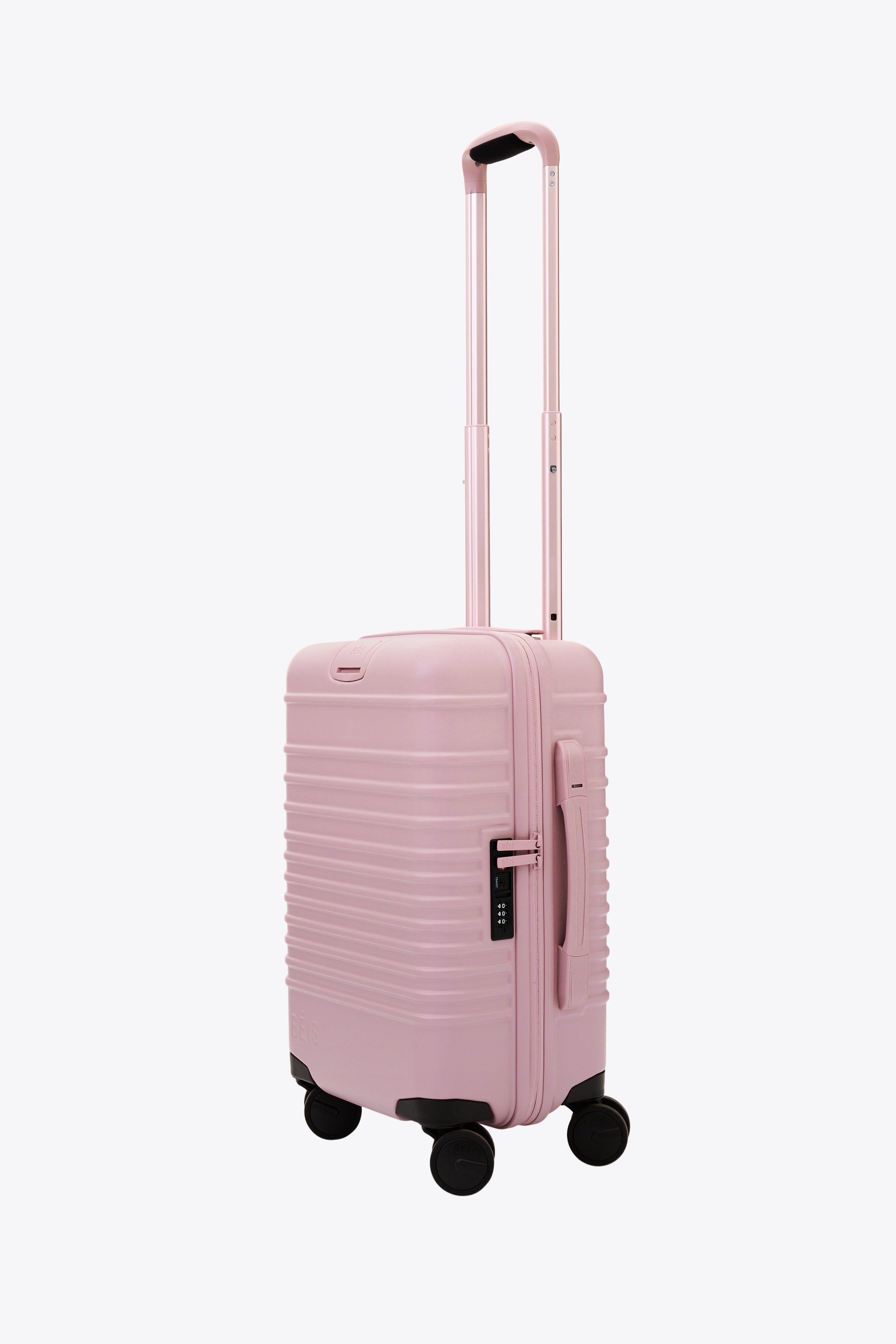 Pink suitcase carry on sale