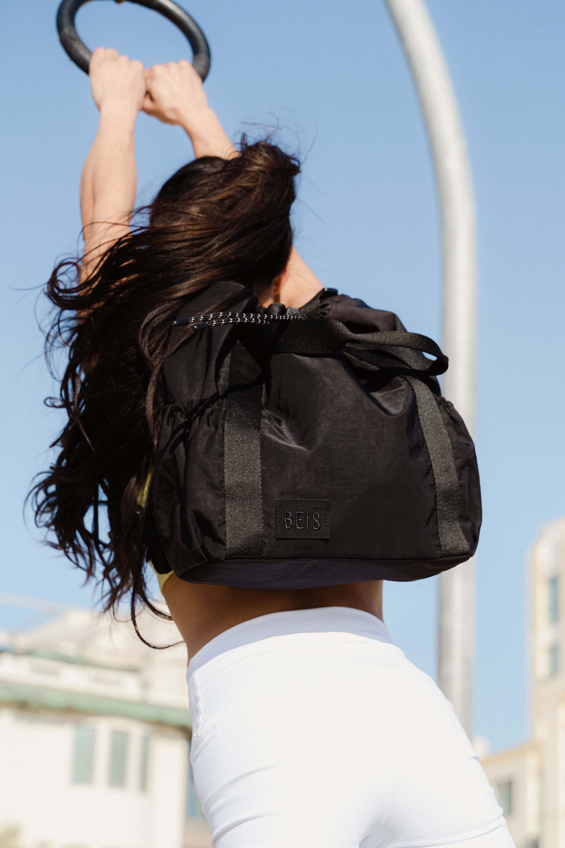 Sport Tote Black Front on Model on Gymnastic Rings