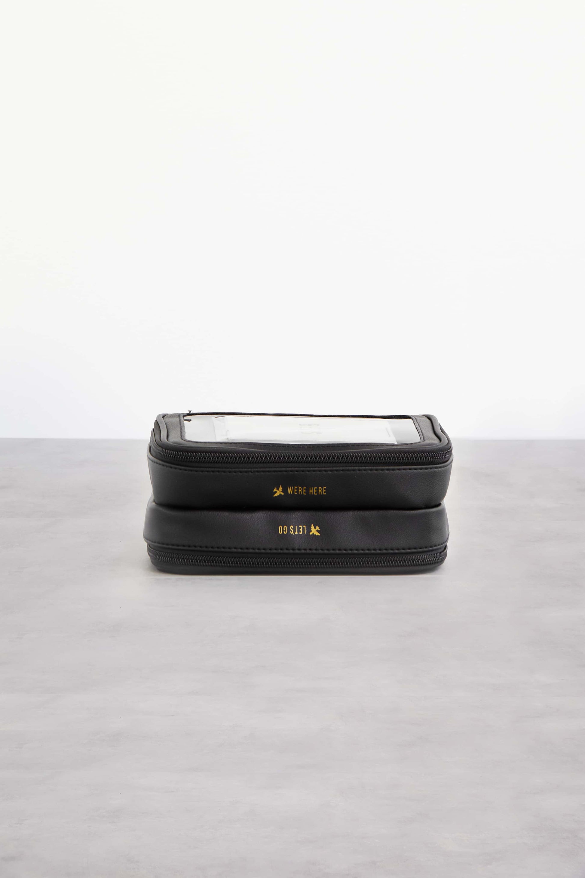 On The Go Essential Case in Black Laying on its Side Bottom Showing