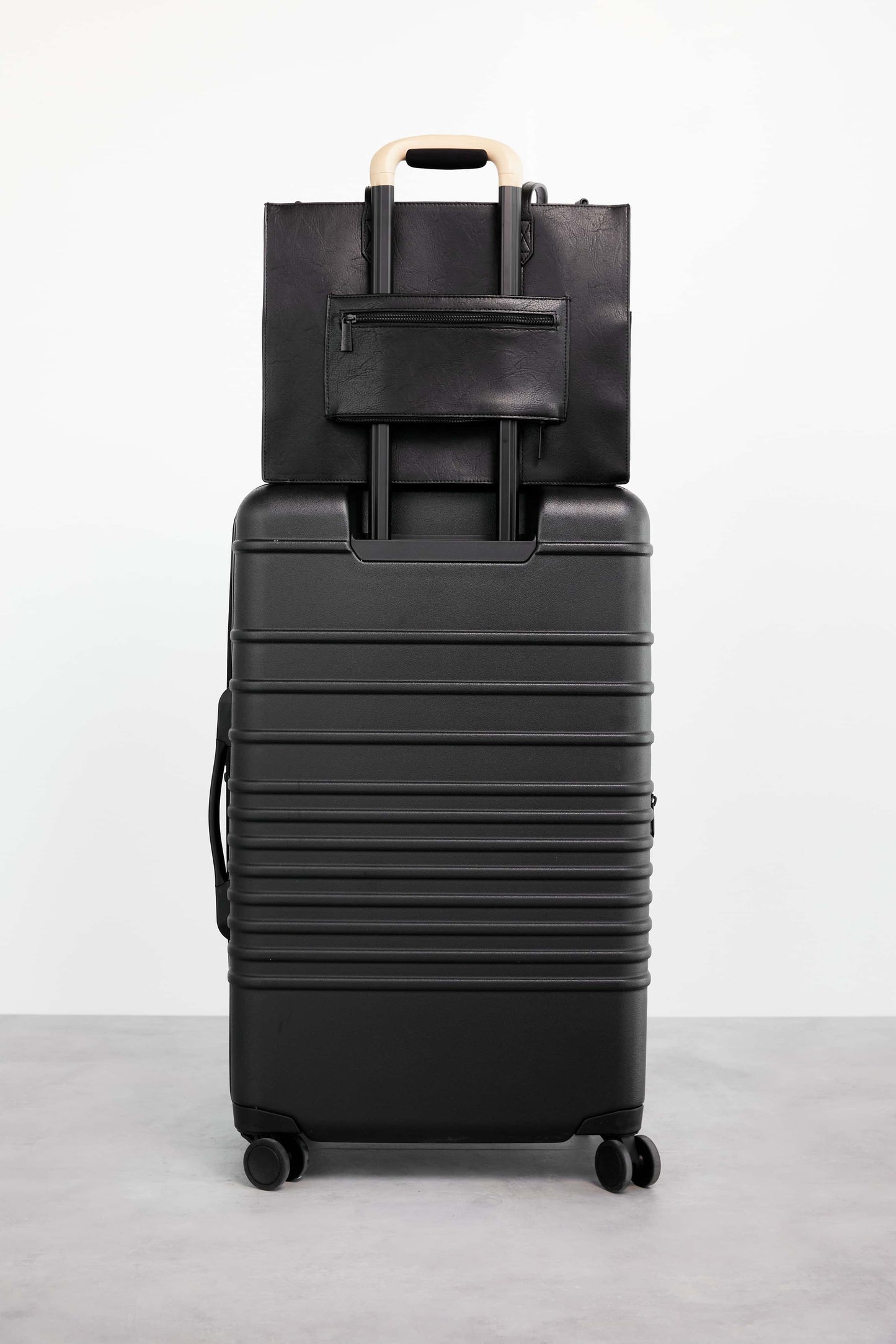 Work Tote Black Back Trolley Sleeve Stacked on Suitcase
